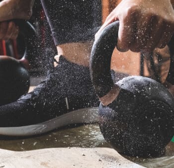 Woman lifting kettlebells